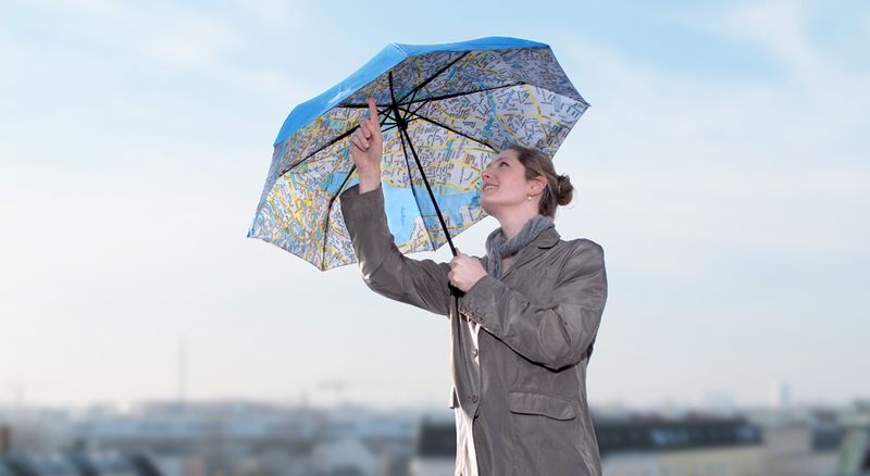 Geschäftsideen Tourismus: Regenschirm und Stadtplan in einem ...